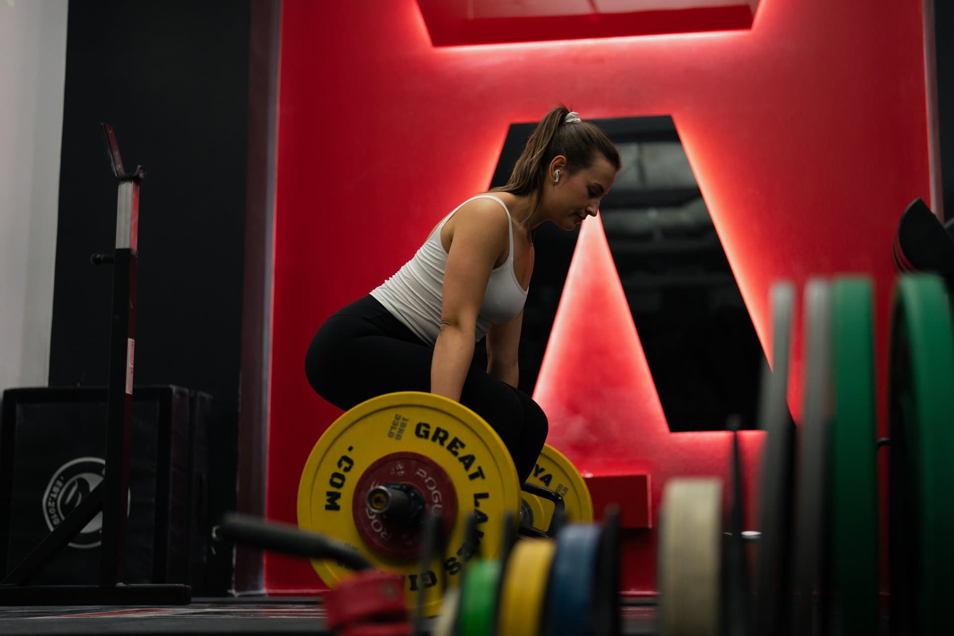 Client performing a barbell deadlift under coaching supervision at Arzadon Fitness Toronto