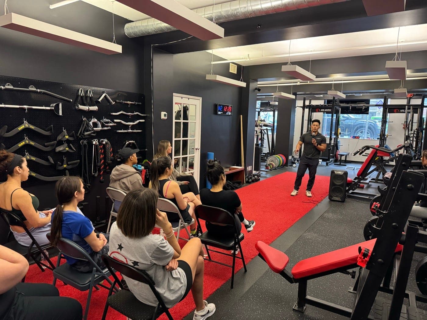 Jay Arzadon presents to seated group at Arzadon Fitness community education event